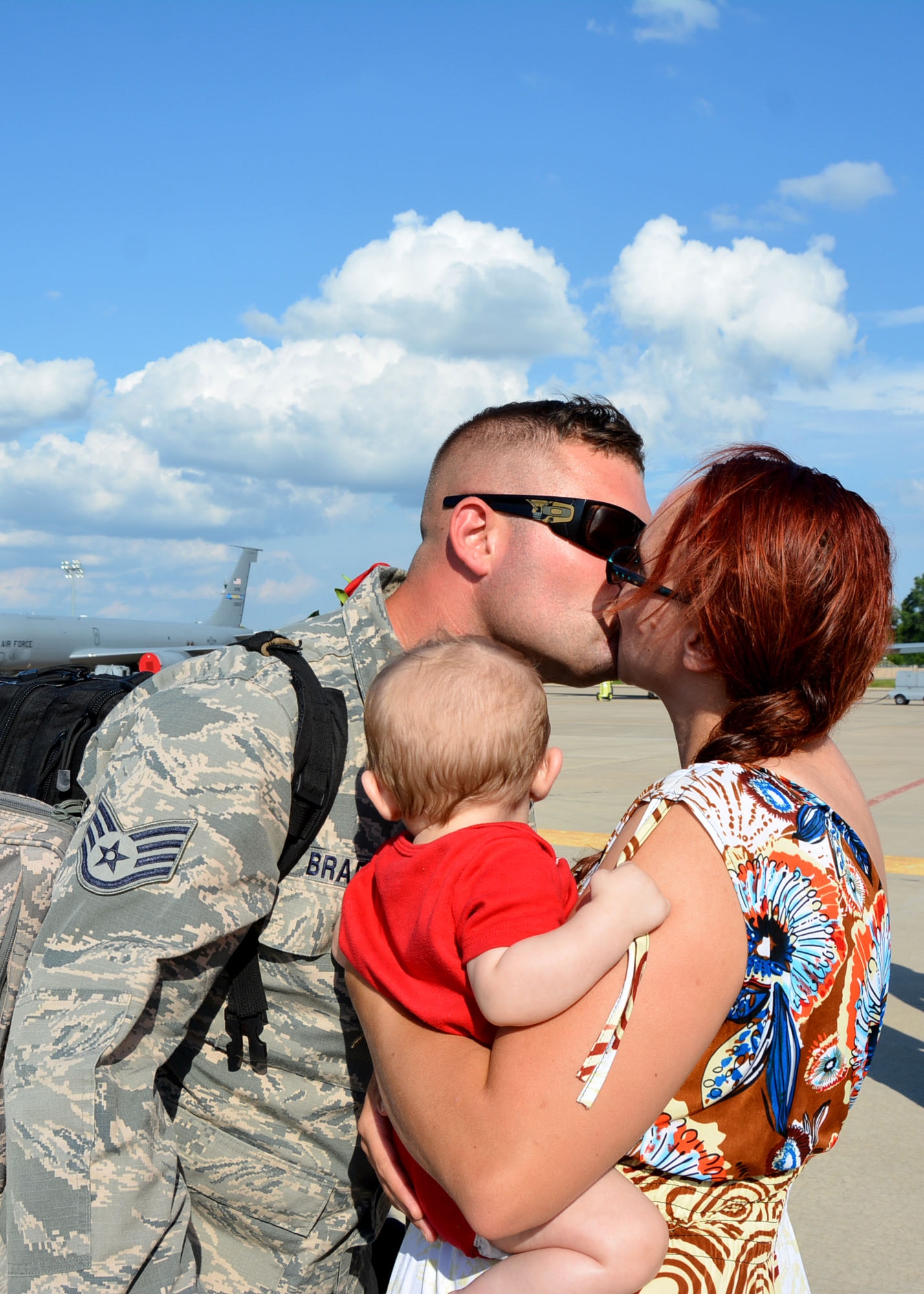 Staff Sgt. James Bradshaw kisses his wife, Senior Airman Jammie Bradshaw, both with the 507th Aircraft Maintenance Squadron at Tinker Air Force Base, Okla., June 11, 2016, following a four-month deployment to Southwest Asia. The 507th Air Refueling Wing consists of three subordinate groups and 11 squadrons while employing more than 1,100 men and women. (U.S. Air Force photo/Tech. Sgt. Lauren Gleason)