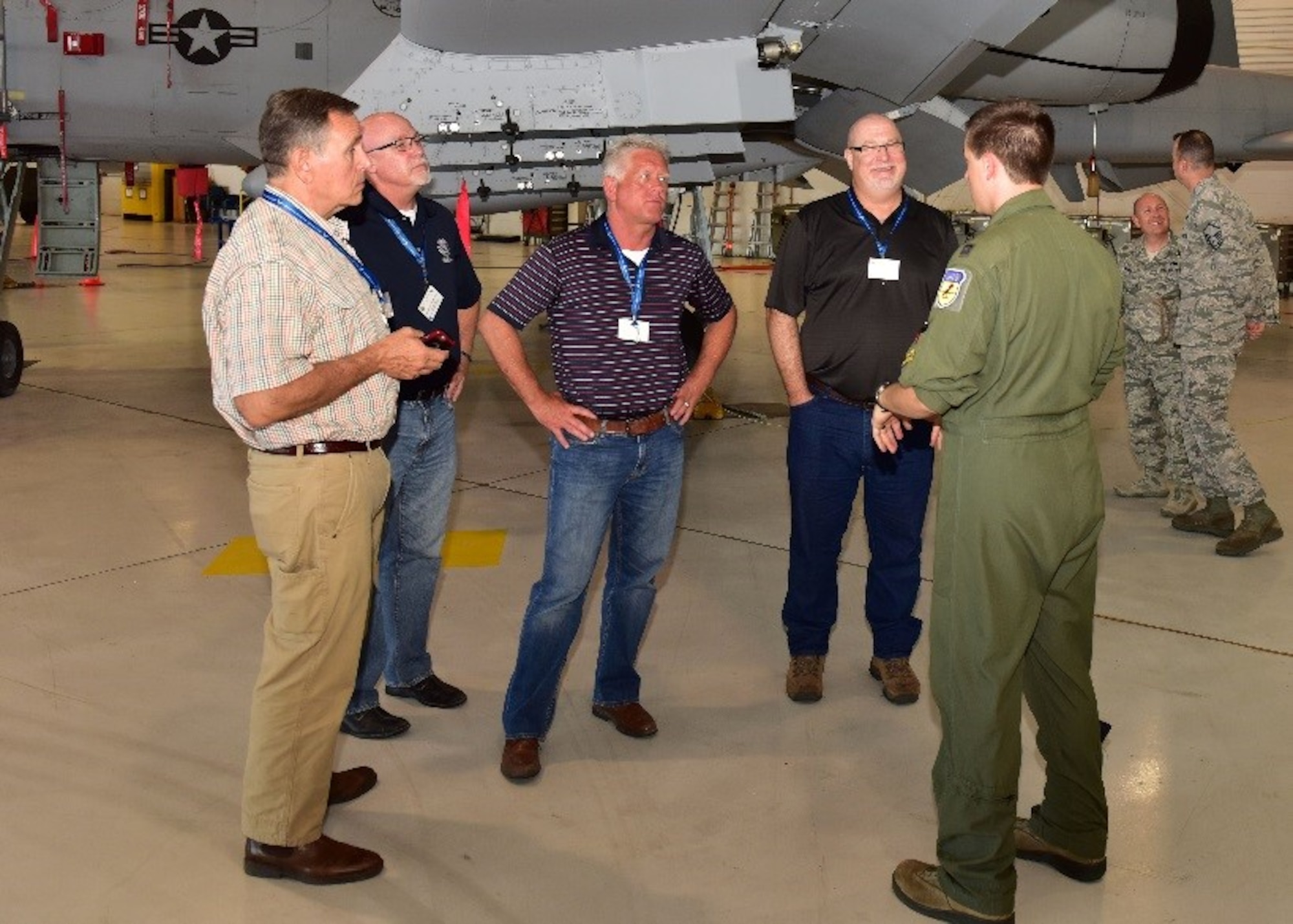 Civic leaders listen to Capt. Jonathan Griffin, 303rd Fighter Squadron pilot, as he provides information on the A-10C Thunderbolt II June 7 during the 944th Fighter Wing Civic Leader tour at Whiteman Air Force Base, Mo. (U.S. Air Force photo by Tech. Sgt. Louis Vega Jr.)