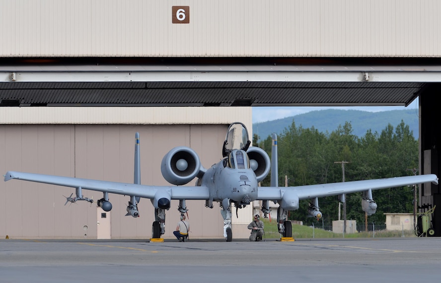 U.S. Air Force maintenance Airmen wait to launch an A-10 Thunderbolt II twin-engine, ground-attack aircraft assigned to the 354th Fighter Squadron (FS) out of Davis-Monthan Air Force Base, Ariz., for an afternoon sortie from Eielson Air Force Base, Alaska, June 6, 2016, during RED FLAG-Alaska (RF-A) 16-2. RF-A is a series of Pacific Air Forces commander-directed field training exercises that enable U.S. and partner nation forces like the 354 FS "Bulldogs" to sharpen their combat skills by flying simulated combat sorties in a realistic threat environment inside the more than 67,000 square mile Joint Pacific Alaska Range Complex, the largest instrumented air, ground and electronic combat training range in the world. (U.S. Air Force photo by Master Sgt. Karen J. Tomasik/Released)