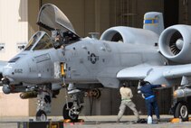 U.S. Air Force maintenance Airmen, right, make adjustments to an A-10 Thunderbolt II twin-engine, ground-attack aircraft assigned to the 354th Fighter Squadron (FS) out of Davis-Monthan Air Force Base, Ariz., as another maintainer guides the work from the aircraft's cockpit June 6, 2016, during RED FLAG-Alaska (RF-A) 16-2 at Eielson Air Force Base, Alaska. This Pacific Air Forces commander-directed field training exercise enables U.S. and partner nation forces like the "Bulldogs" maintainers to sharpen their maintenance skills by launching aircraft and aircrews for simulated combat sorties in a realistic threat environment. (U.S. Air Force photo by Master Sgt. Karen J. Tomasik/Released)