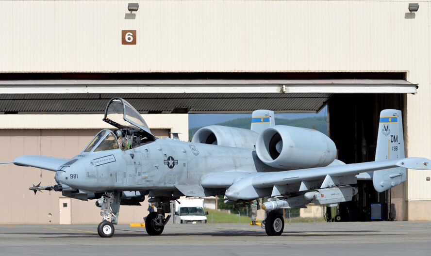 A U.S. Air Force A-10 Thunderbolt II pilot assigned to the 354th Fighter Squadron (FS) out of Davis-Monthan Air Force Base, Ariz., taxis her twin-engine, ground-attack aircraft out of a hangar on Eielson Air Force Base, Alaska, June 6, 2016, during RED FLAG-Alaska (RF-A) 16-2. RF-A is a series of Pacific Air Forces commander-directed field training exercises that enable U.S. and partner nation forces like the 354 FS "Bulldogs" to sharpen their combat skills by flying simulated combat sorties in a realistic threat environment inside the more than 67,000 square mile Joint Pacific Alaska Range Complex, the largest instrumented air, ground and electronic combat training range in the world. (U.S. Air Force photo by Master Sgt. Karen J. Tomasik/Released)