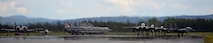 A U.S. Air Force A-10 Thunderbolt II twin-engine, ground-attack aircraft assigned to the 354th Fighter Squadron (FS) out of Davis-Monthan Air Force Base, Ariz., taxis into place next to Republic of Singapore Air Force and U.S. Air Force F-16 Fighting Falcons in preparation for an afternoon sortie from the Eielson Air Force Base, Alaska, flight line alongside taxiing F-15E Strike Eagles deployed from Royal Air Force Lakeneath, England, June 7, 2016, during RED FLAG-Alaska (RF-A) 16-2. Pilots, aircrew, maintainers and support personnel coverge at Eielson for RF-A, is a series of Pacific Air Forces commander-directed field training exercises that enable joint and international forces to sharpen their combat skills by flying simulated combat sorties together in a realistic threat environment. (U.S. Air Force photo by Master Sgt. Karen J. Tomasik/Released)