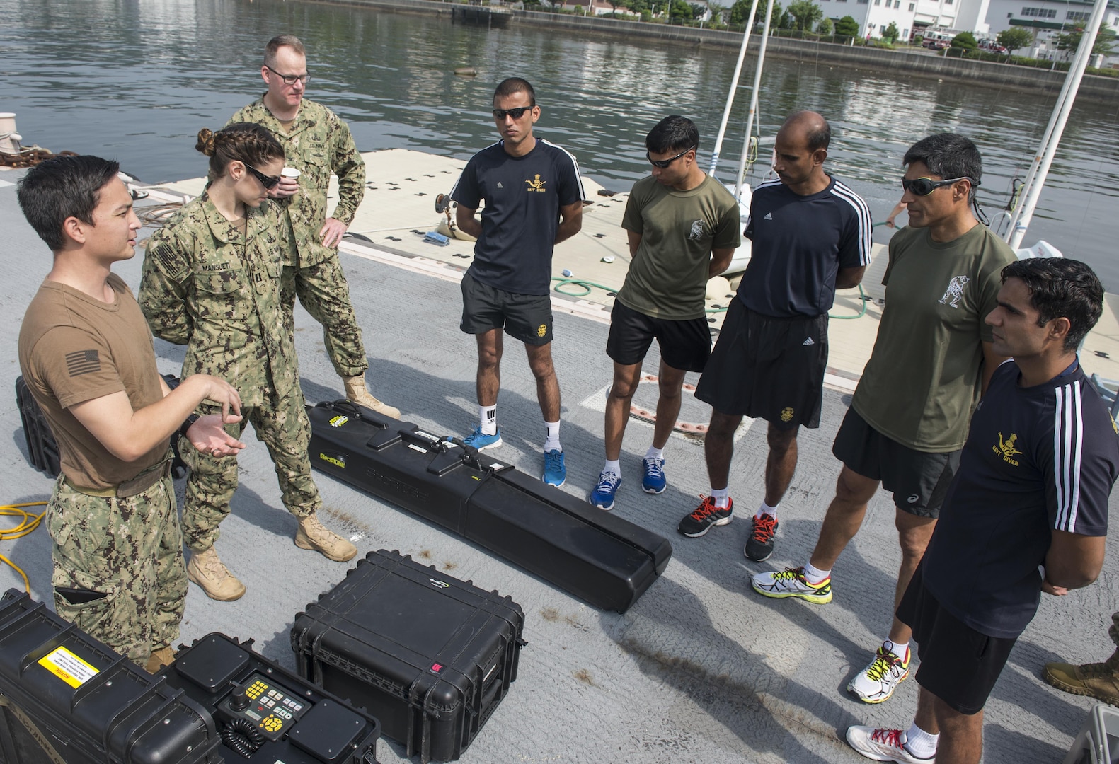 A U.S. Navy Explosive Ordnance Disposal (EOD) technician assigned to EOD Mobile Unit 11 explains an unmanned underwater vehicle system to Indian EOD technicians during exercise Malabar 2016. A trilateral maritime exercise, Malabar is designed to enhance dynamic cooperation between the Indian Navy, Japan Maritime Self-Defense Force (JMSDF) and U.S. Navy forces in the Indo-Asia-Pacific. (U.S. Navy combat camera photo by Mass Communication Specialist 1st Class Charles E. White/Released)