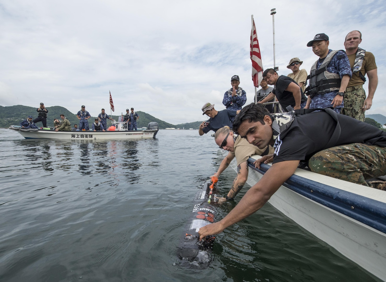 SASEBO, Japan (June 13, 2016) – An Indian Navy Explosive Ordnance Disposal (EOD) technician and a U.S. Navy Sailor launch a MK18 Mod. One unmanned underwater vehicle during a mine countermeasures training mission near Sasebo during Exercise Malabar 2016, June 13. A trilateral maritime exercise, Malabar is designed to enhance dynamic cooperation between the Indian Navy, Japanese Maritime Self-Defense Force (JMSDF) and U.S. Navy forces in the Indo-Asia- Pacific.

(U.S. Navy photo by Mass Communication Specialist 1st Class Charles E. White/ Released)