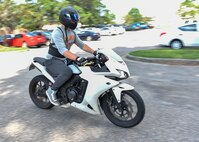Airman 1st Class Evan Hittle, a 437th a 437th Aircraft Maintenance Squadron instrument and flight control systems specialist, rides his motorcycle at Joint Base Charleston, June 9, 2016. In his free time, in addition to riding his motorcycle, Hittle likes to work on its engine, play video games and go to the beach. (U.S. Air Force Photo/Airman Megan Munoz)