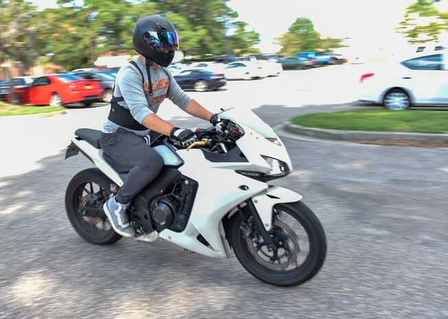 Airman 1st Class Evan Hittle, a 437th a 437th Aircraft Maintenance Squadron instrument and flight control systems specialist, rides his motorcycle at Joint Base Charleston, June 9, 2016. In his free time, in addition to riding his motorcycle, Hittle likes to work on its engine, play video games and go to the beach. (U.S. Air Force Photo/Airman Megan Munoz)