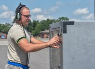 Airman 1st Class Evan Hittle, a 437th Aircraft Maintenance Squadron instrument and flight control systems specialist, turns on a power cart at Joint Base Charleston, June 11, 2016. Hittle is responsible for performing maintenance and solving malfunctions on C-17 Globemaster III aircraft through the use of technical publications, wiring diagrams and schematics. (U.S. Air Force Photo/Airman Megan Munoz)