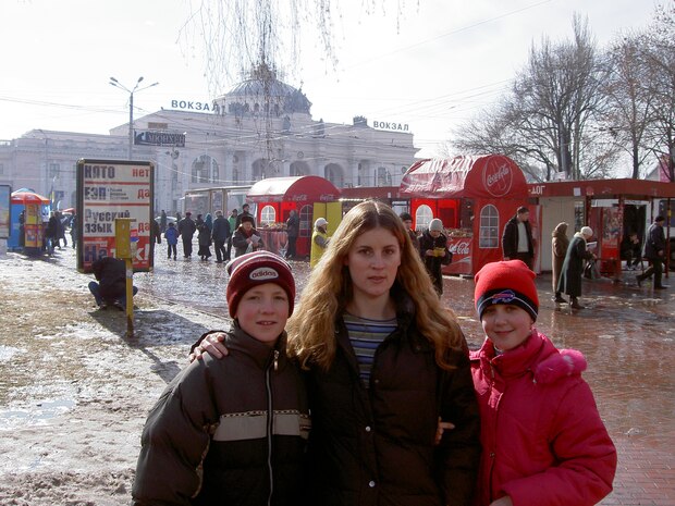 Airman 1st Class Evan Hittle, a 437th Aircraft Maintenance Squadron instrument and flight control systems specialist, and his sister, Natasha, meet their adoptive mother, Laura Alvstad, in Odessa, Ukraine, February 6, 2007. Hittle lived in two orphanages with his sister for seven years before being adopted by an American family. (U.S. Air Force Curtesy Photo)