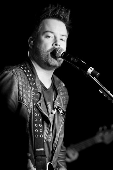 David Cook performs for military members and their families at Minot Air Force Base, N.D., May 30, 2016. The 2008 American Idol winner performed tracks from his most recent album and popular songs by Michael Jackson and Led Zeppelin. (U.S. Air Force photo/Airman 1st Class J.T. Armstrong)