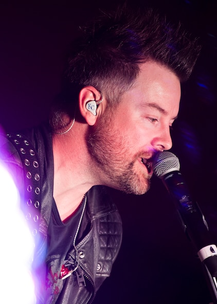 David Cook performs for military members and their families at Minot Air Force Base, N.D., May 30, 2016. The 2008 American Idol winner performed tracks from his most recent album and popular songs by Michael Jackson and Led Zeppelin. (U.S. Air Force photo/Airman 1st Class J.T. Armstrong)