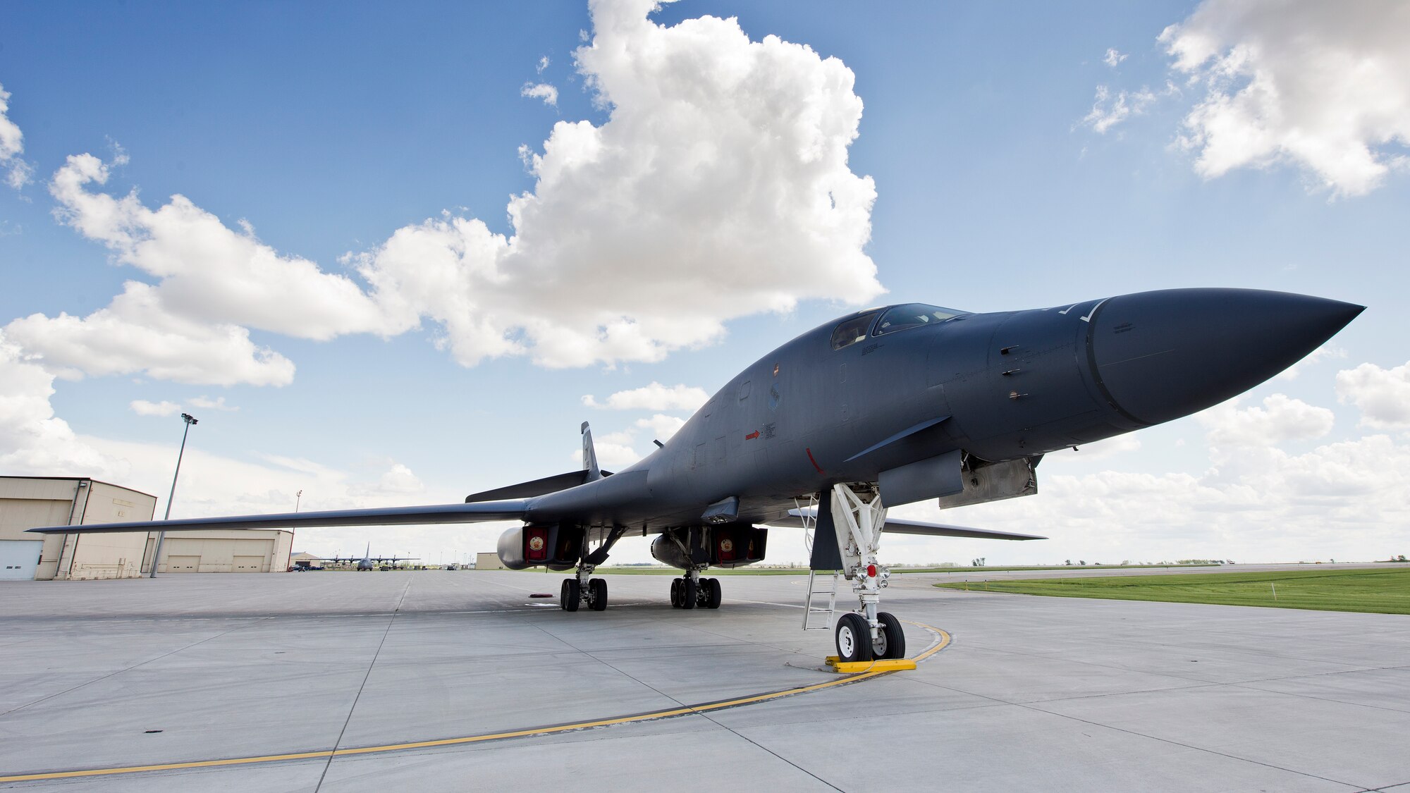 A B-1B Lancer from Dyess Air Force Base, Texas sits at Base Operations at Minot AFB, N.D., June 3, 2016. Aircraft from around Air Force Global Strike Command visited Minot for the 5th Bomb Wing change of command. (U.S. Air Force photos/Airman 1st Class J.T. Armstrong)