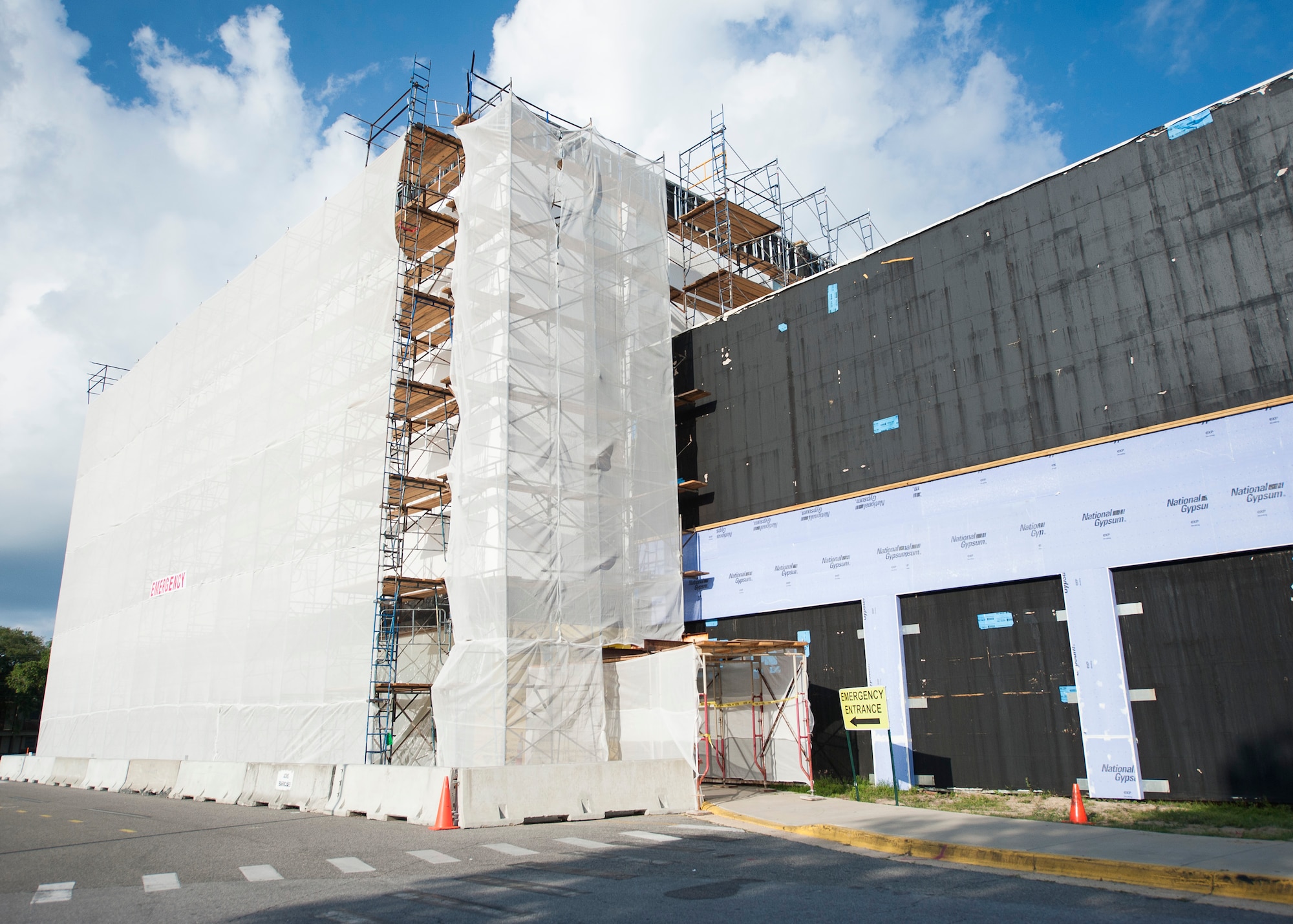Eglin hospital’s emergency entrance wrapped in construction scaffolding due to an exterior overhaul. The renovations will update and improve the 50-year-old structure. (U.S. Air Force photo/Ilka Cole) 