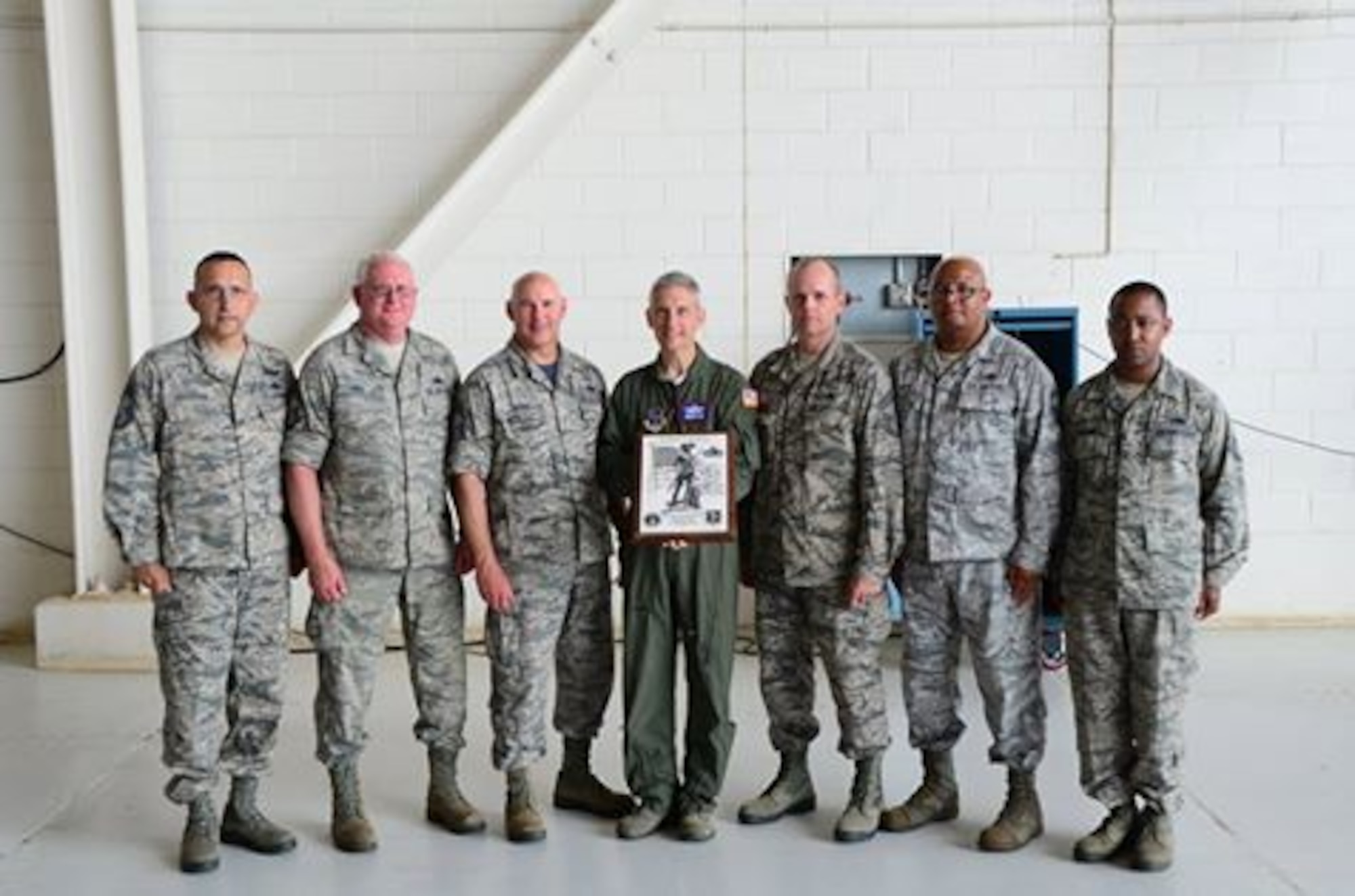 Maj. Gen. William O. Hill, Commander Mississippi Air National Guard, presents the Air National Guard Maintenance Effectiveness Award (small unit category) to 172d Maintenance Group at Thompson Field, Jackson, Miss., June 4, 2016. Pictured L-R, Chief Master Sgt. David Easterling, Chief Master Sgt. Raymond May, Chief Master Sgt. Norman Hatch, Maj. Gen. William O. Hill, Chief Master Sgt. Willis Allen, Senior Master Sgt. Clarence Hayes and Tech Sgt Telshaun Davis(Air Force photo by Tech. Sgt. Marvin B. Moore/Released)