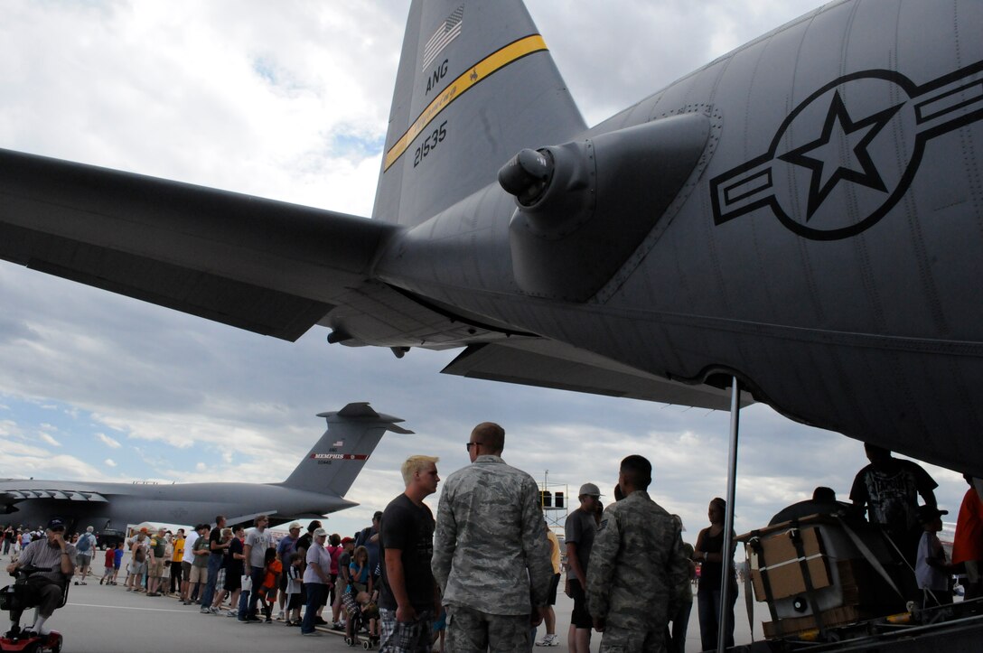 A line of eager guests, at the Wyoming Air National Guard’s Air Power Air Show, wait for their turn to tour a Wyoming Air National Guard C-130 cargo plane at the Wyoming Air National Guard Base, Cheyenne, Wyo., July 27, 2011. (Wyoming National Guard/1st Lt. Christian Venhuizen)