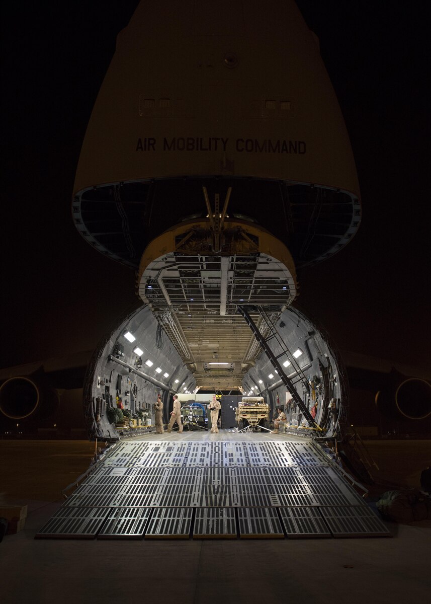 A C-5M Super Galaxy sits with its forward nose opened to allow an on-load of cargo May 31, 2016, at Camp Lemonnier, Djibouti. This C-5M travelled more than 26,000 miles on its circumnavigation of the globe. (U.S. Air Force photo/Senior Airman Zachary Cacicia)