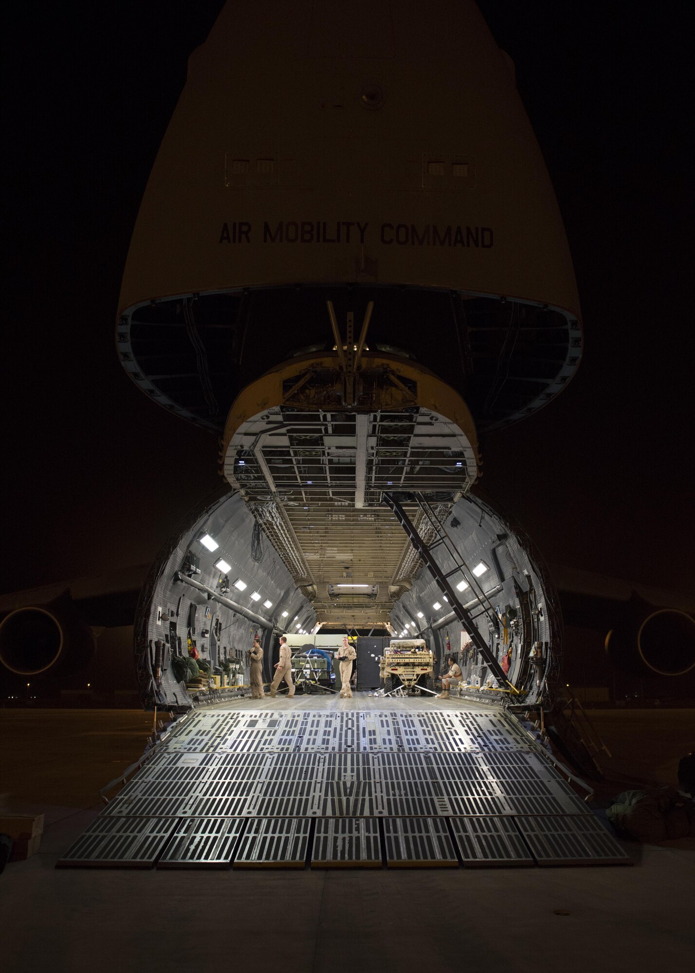 A C-5M Super Galaxy sits with its forward nose opened to allow an on-load of cargo May 31, 2016, at Camp Lemonnier, Djibouti. This C-5M travelled more than 26,000 miles on its circumnavigation of the globe. (U.S. Air Force photo/Senior Airman Zachary Cacicia)