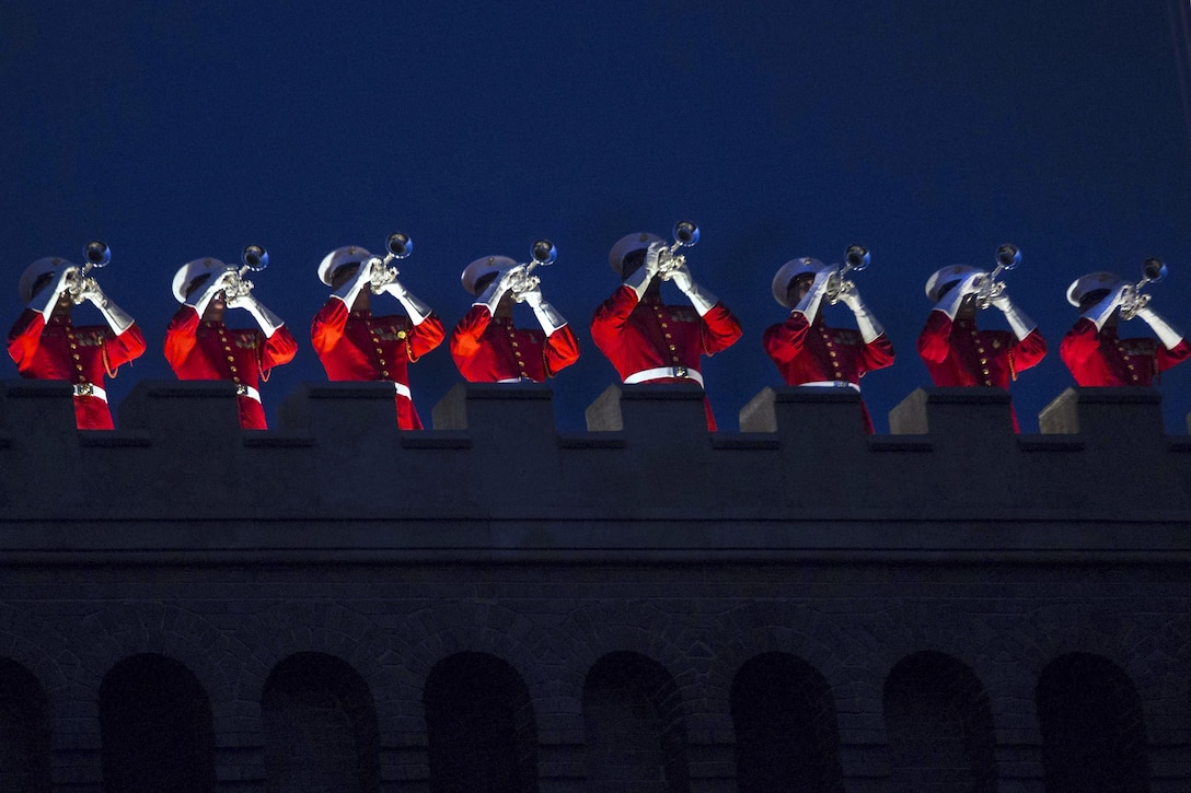 The U.S. Marine Drum and Bugle Corps performs during an evening parade at Marine Barracks Washington, D.C., June 10, 2016. Marine Corps Lt. Gen. Michael G. Dana, deputy commandant for installations and logistics, hosted the event, and U.S. Sen. Maize Hirono of Hawaii was the guest of honor. Marine Corps photo by Cpl. Chi Nguyen