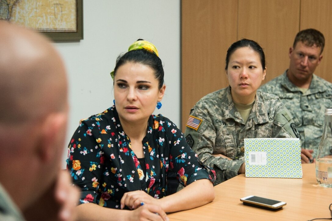 Maj. Kris Chow (center) and Spc. Matthew Klus (right), assigned to the 457th Civil Affairs Battalion, 361st Affairs Brigade, 7th Civil Support Command, participate in a meeting in preparation of the upcoming Humanitarian Civil Assistance (HCA) project in Chisinau, Moldova, June 3, 2016. As part of the European Command’s (EUCOM) Humanitarian and Civic Assistance Program, the 123rd Civil Engineering Squadron from the Kentucky Air National Guard, 185th Engineering Squadron from Iowa Air National Guard, 457th Civil Affairs Battalion and Moldovan Land Forces collaborate to renovate to the kitchen at Special School Number 12 for Hearing Impaired Children and assist with renovations for the non-governmental organization La Via in Chisinau, Moldova, June 3-25, 2016.