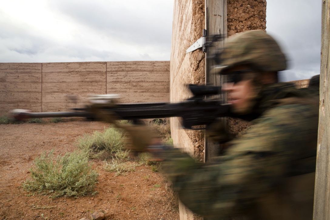 Marines clear a building during Exercise Predator Strike at Cultana Training Area, Australia, June 5, 2016. The Marines are assigned to Charlie Company, 1st Battalion, 1st Marine Regiment. The annual exercise allows Marines to enhance their skills and train with Australian forces. Marine Corps photo by Cpl. Carlos Cruz Jr.