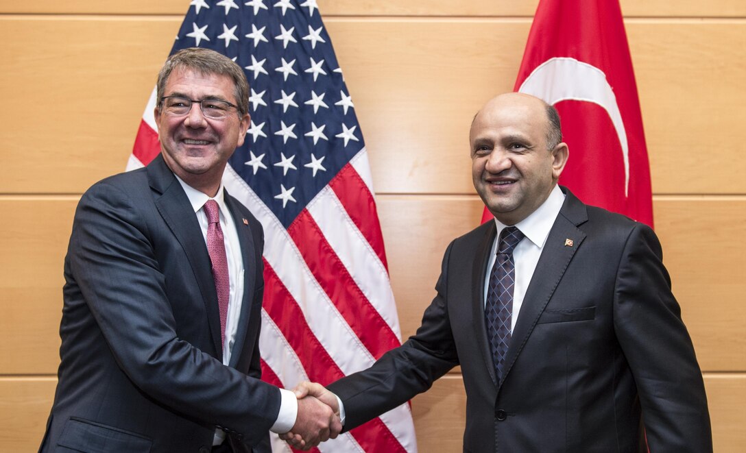 Defense Secretary Ash Carter, left, poses for a picture withTurkish Defense Minister Fikri Isik at NATO headquarters in Brussels, June 14, 2016. DoD photo by Air Force Staff Sgt. Brigitte N. Brantley