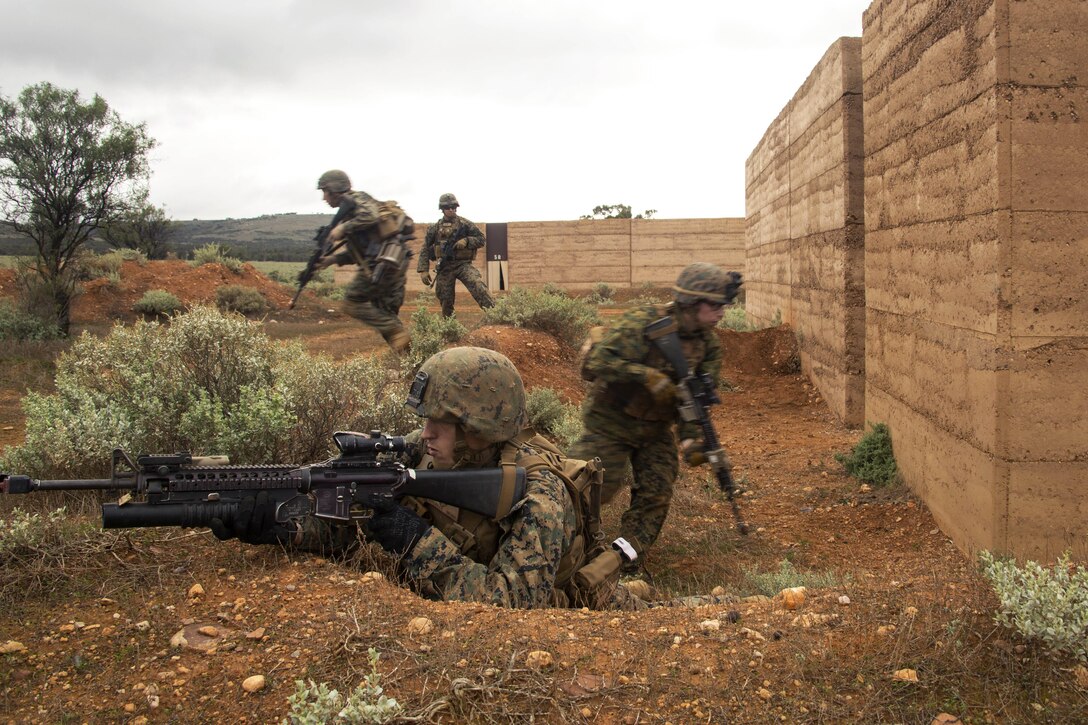 Marines maneuver while clearing multiple buildings during Exercise Predator Strike at Cultana Training Area, Australia, June 5, 2016. Marine Corps photo by Cpl. Carlos Cruz Jr.