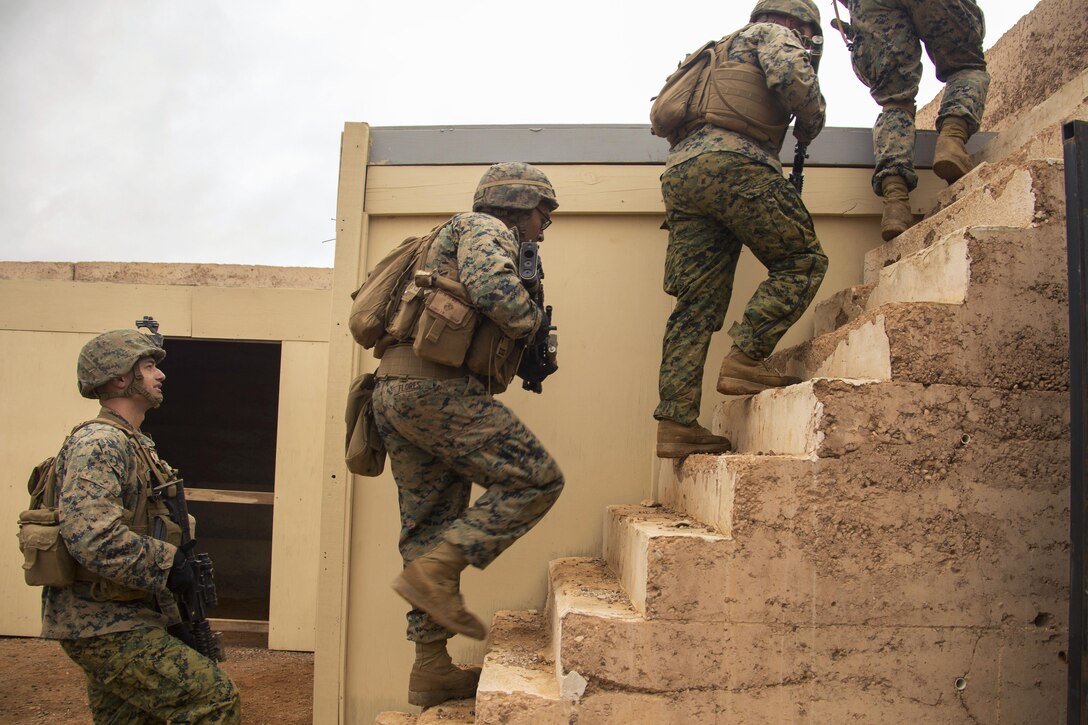 Marines move to the roof of a building to post security during Exercise Predator Strike at Cultana Training Area, Australia, June 5, 2016. Marine Corps photo by Cpl. Carlos Cruz Jr.