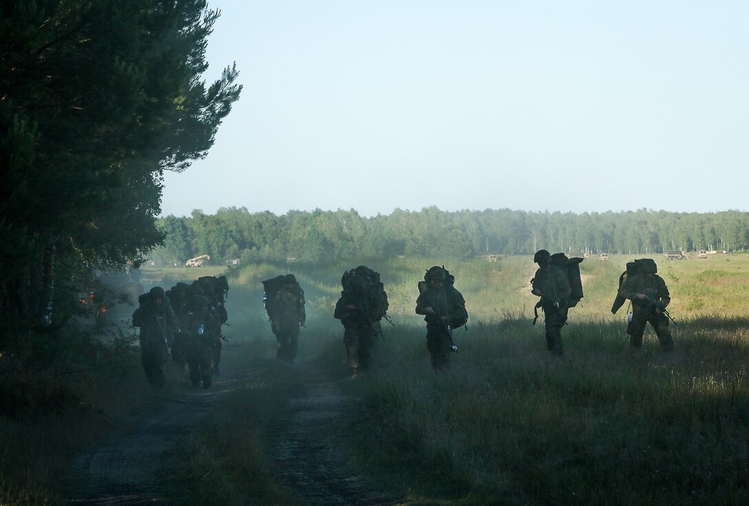 Polish paratroopers move out to the next objective after airborne operation, part of Swift Response 16 onto Torun drop zone in Poland, June 7, 2016. Army photo by Sgt. Juan F. Jimenez
