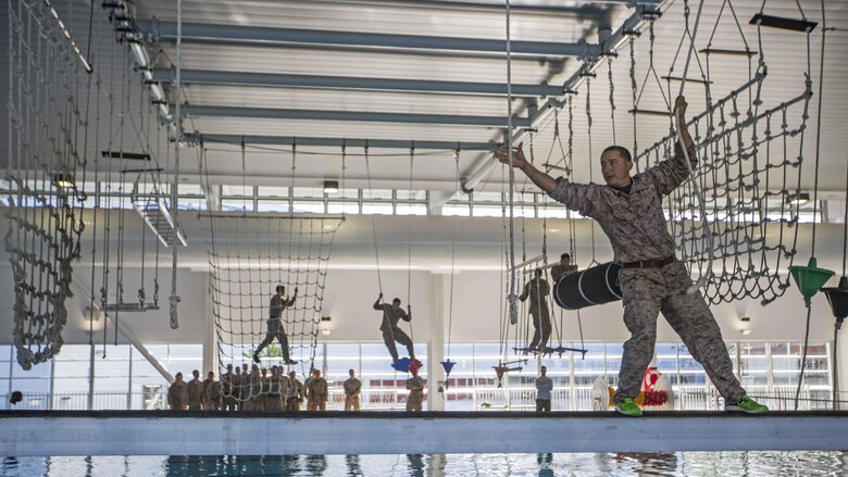U.S. Marine Corps Sgt. Manuel Suarez, a squad leader, walks along a beam on an over-water obstacle course at Gallipoli Barracks, Queensland, Australia, June 7, 2016. The course is part of a three day period of sustainment training to keep Marines in good physical condition during Marine Rotational Force – Darwin. MRF-D is a six-month deployment of Marines into Darwin, Australia, where they will conduct exercises and train with the Australian Defence Forces, strengthening the U.S.-Australia alliance. Suarez, from Pixley, California, is with 1st Battalion, 1st Marine Regiment, MRF-D.