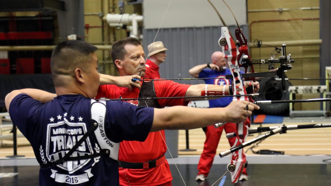 U.S. Marine Corps veteran Christopher McGleinnaiss, left, and Master Sgt. Mark Mann practice archery in preparation for the 2016 Department of Defense Warrior Games at the U.S. Military Academy at West Point, New York, June 13, 2016. McGleinnaiss, an Orinda, Calif., native, and Mann, a Salinas, Calif., native, are members of the 2016 DoD Warrior Games Team Marine Corps. The 2016 DoD Warrior Games is an adaptive sports competition for wounded, ill and injured Service members and veterans from the U.S. Army, Marine Corps, Navy, Air Force, Special Operations Command and the British Armed Forces.
