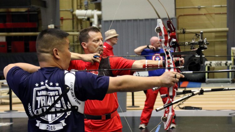 U.S. Marine Corps veteran Christopher McGleinnaiss, left, and Master Sgt. Mark Mann practice archery in preparation for the 2016 Department of Defense Warrior Games at the U.S. Military Academy at West Point, New York, June 13, 2016. McGleinnaiss, an Orinda, Calif., native, and Mann, a Salinas, Calif., native, are members of the 2016 DoD Warrior Games Team Marine Corps. The 2016 DoD Warrior Games is an adaptive sports competition for wounded, ill and injured Service members and veterans from the U.S. Army, Marine Corps, Navy, Air Force, Special Operations Command and the British Armed Forces.