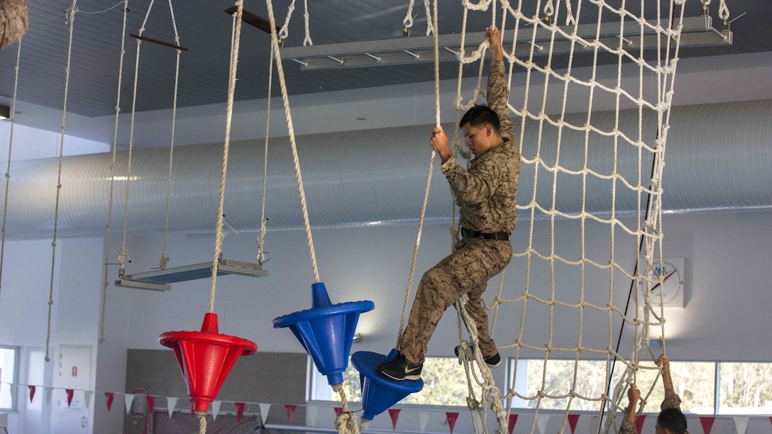 U.S. Marine Corps Cpl. Sean E. Rodriquez, a team leader, passes from one obstacle to another on an over-water obstacle course at Gallipoli Barracks, Queensland, Australia, June 7, 2016. The course is part of a three day period of sustainment training to keep Marines in good physical condition during Marine Rotational Force – Darwin. MRF-D is a six-month deployment of Marines into Darwin, Australia, where they will conduct exercises and train with the Australian Defence Forces, strengthening the U.S.-Australia alliance. Rodriguez, from San Antonio, Texas, is with 1st Battalion, 1st Marine Regiment, MRF-D.