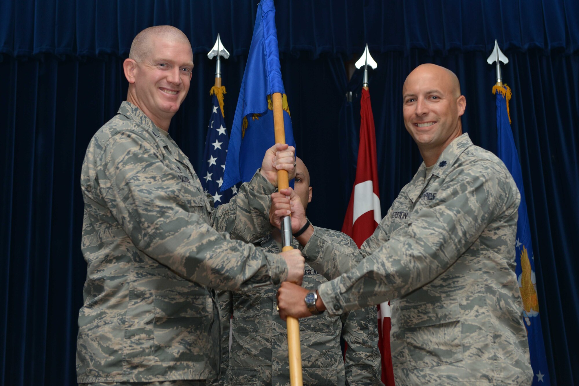 U.S. Air Force Lt. Col. Timothy Meerstein, 39th Communications Squadron incoming commander, receives command from U.S. Air Force Col. John Walker, 39th Air Base Wing commander, during a change of command ceremony June 14, 2016, at Incirlik Air Base, Turkey. Prior to taking command, Meerstein served as the chief of the operations division, communications and information directorate, Headquarters Air Force Special Operations Command, Hurlburt Field, Florida. (U.S. Air Force photo by Senior Airman John Nieves Camacho/Released)