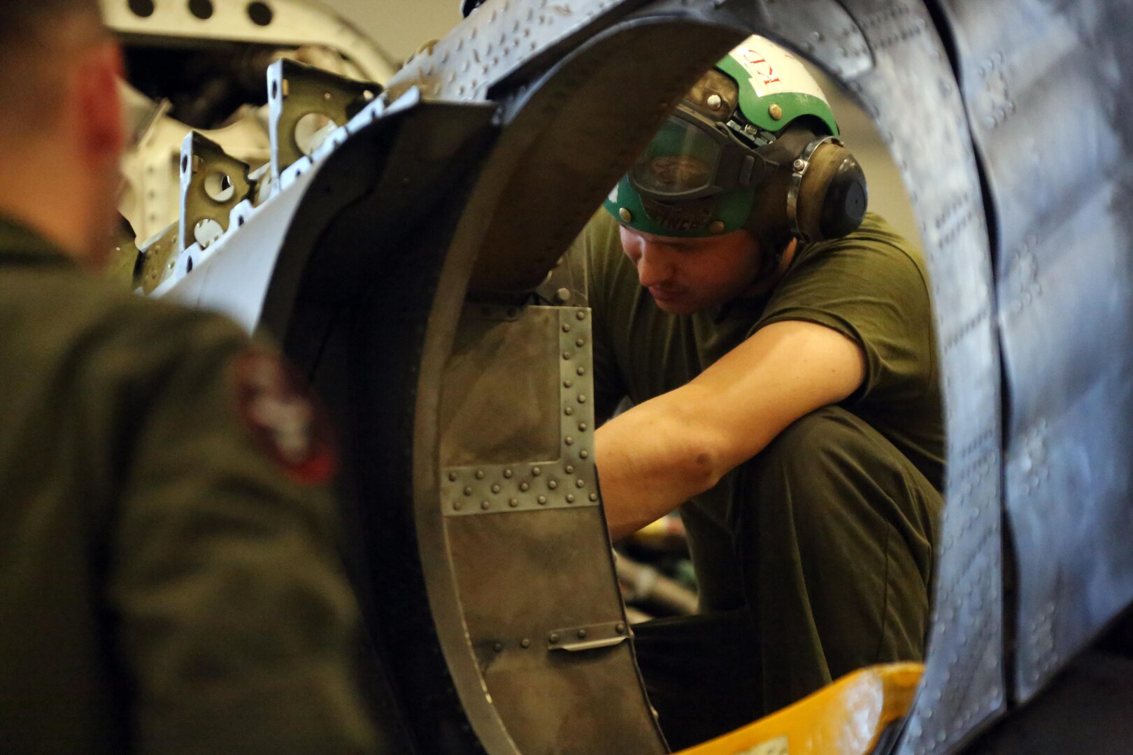 Marines with Marine Attack Training Squadron 203 conduct maintenance inside an AV-8B Harrier at Marine Corps Air Station Cherry Point, N.C., June 8, 2016. During the past three years, VMAT-203 has trained more than 130 AV-8B pilots and 2,000 AV-8B maintenance personnel. Within that time period, the squadron has flown over 12,000 flight hours, participated in four deployments for instructor and student training and received the Commandant's Aviation Efficiency Award. (U.S. Marine Corps photo by Cpl. N.W. Huertas/ Released)