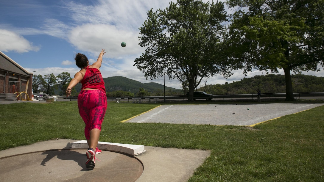 U.S. Marine Corps Sgt. Katherine Pagni throws a shotput at practice during the 2016 Department of Defense Warrior Games at the U.S. Military Academy at West Point, New York, June 13, 2016. Pagni, a Ceres, Calif., native, is a member of the 2016 DoD Warrior Games Team Marine Corps. The 2016 DoD Warrior Games is an adaptive sports competition for wounded, ill and injured Service members and veterans from the U.S. Army, Marine Corps, Navy, Air Force, Special Operations Command and the British Armed Forces.