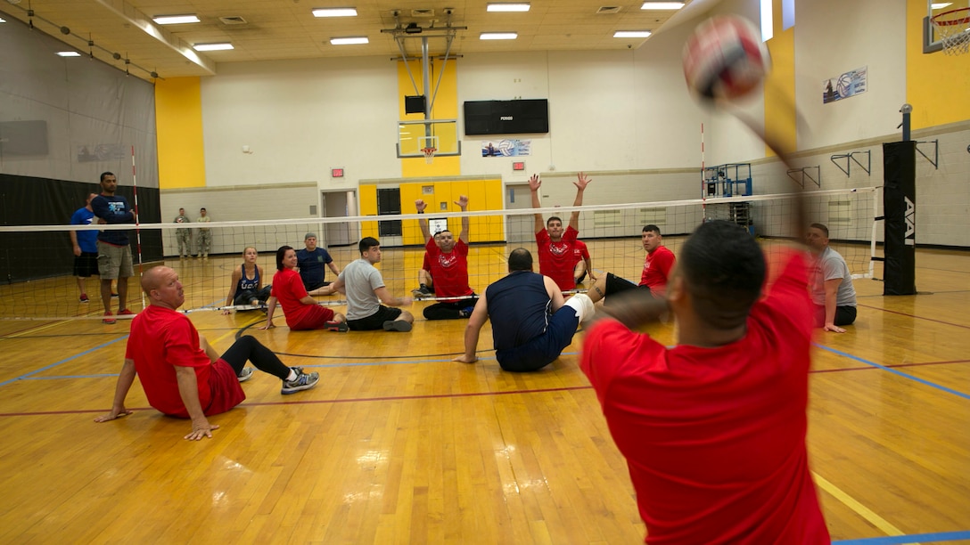 Members of the 2016 Department of Defense Warrior Games Team Marine Corps scrimmage at the close of their first practice session during a 2016 Department of Defense Warrior Games sitting volleyball practice at the U.S. Military Academy at West Point, New York, June 13, 2016. The 2016 DoD Warrior Games is an adaptive sports competition for wounded, ill and injured Service members and veterans from the U.S. Army, Marine Corps, Navy, Air Force, Special Operations Command and the British Armed Forces.