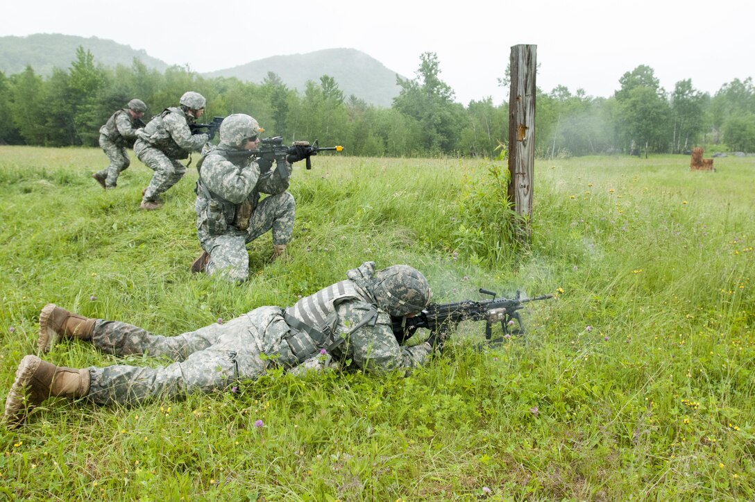 From left to right: Army Spcs. Andrew Denis, Cody Letourneau, David Murphy and Pfc. Patrick Whitton fire at a target during a fire team movement-to-contact exercise at Camp Ethan Allen training site, Jericho, Vt., June 9, 2016. Denis, Letourneau, Murphy and Whitton are assigned to the Vermont National Guard’s Company B, 3rd Battalion, 172nd Infantry Regiment, 86th Infantry Brigade Combat Team, Mountain. Army National Guard photo by Spc. Avery Cunningham