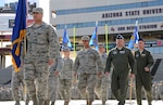 Senior Master Sgt. Alex brown, front, leads the Arizona Air National Guard’s 161st Air Refueling Wing during a march at Sun Devil Stadium in Tempe, Ariz., Dec. 7, 2014. Brown’s prior experience as military training instructor made him the unit’s resident expert on drill and ceremonies and gave him skills that, he said, helped him graduate from law school. 