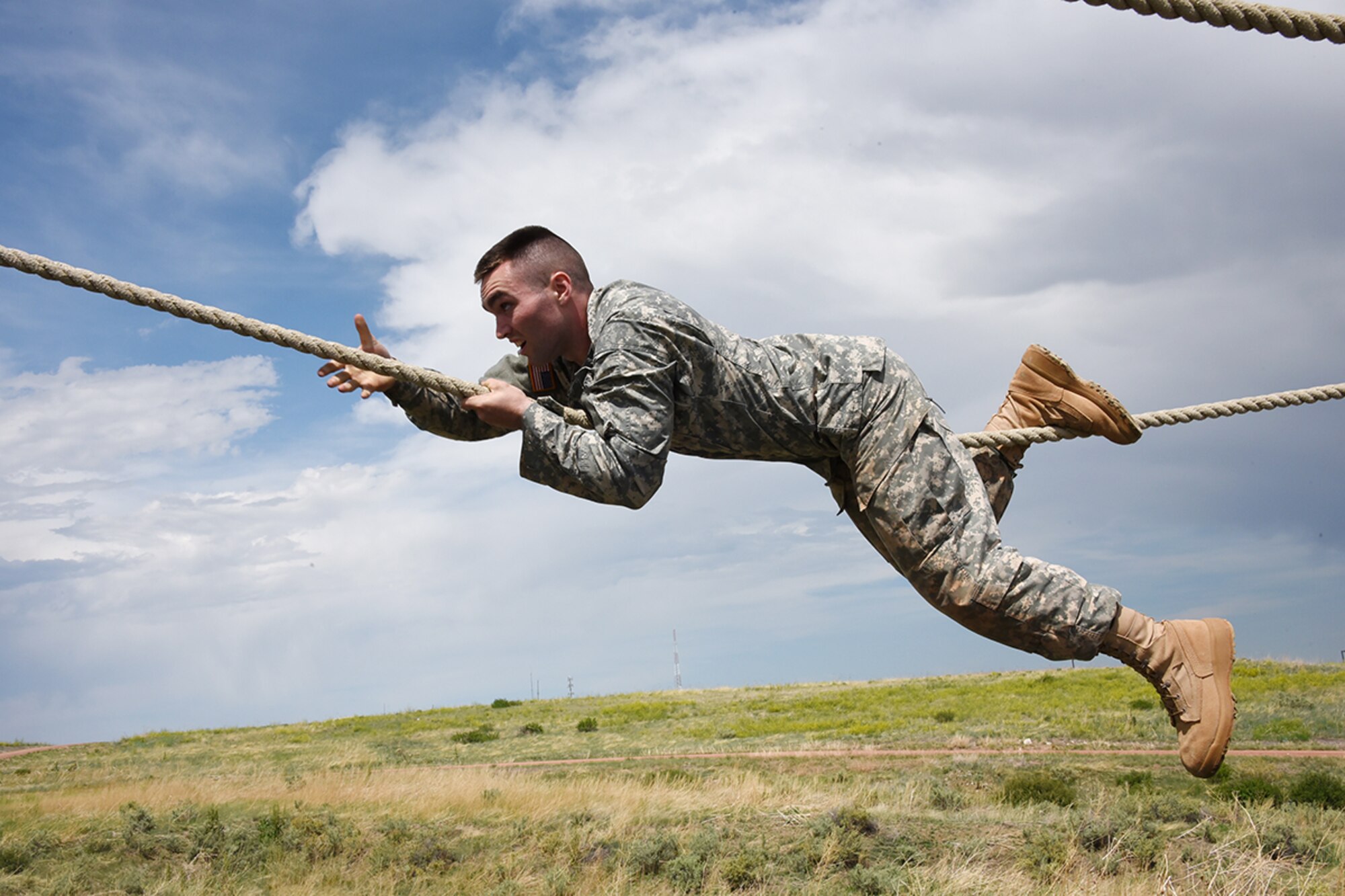 FORT CARSON, Colo. - Spc. Ian Delp, Company D, 53rd Signal Battalion, completes an obstacle during the mystery event of the U.S. Army Space and Missile Defense Command/Army Forces Strategic Command’s Best Warrior Competition June 7 at Fort Carson, Colorado. (Photo by Dottie K. White SMDC/ARSTRAT)