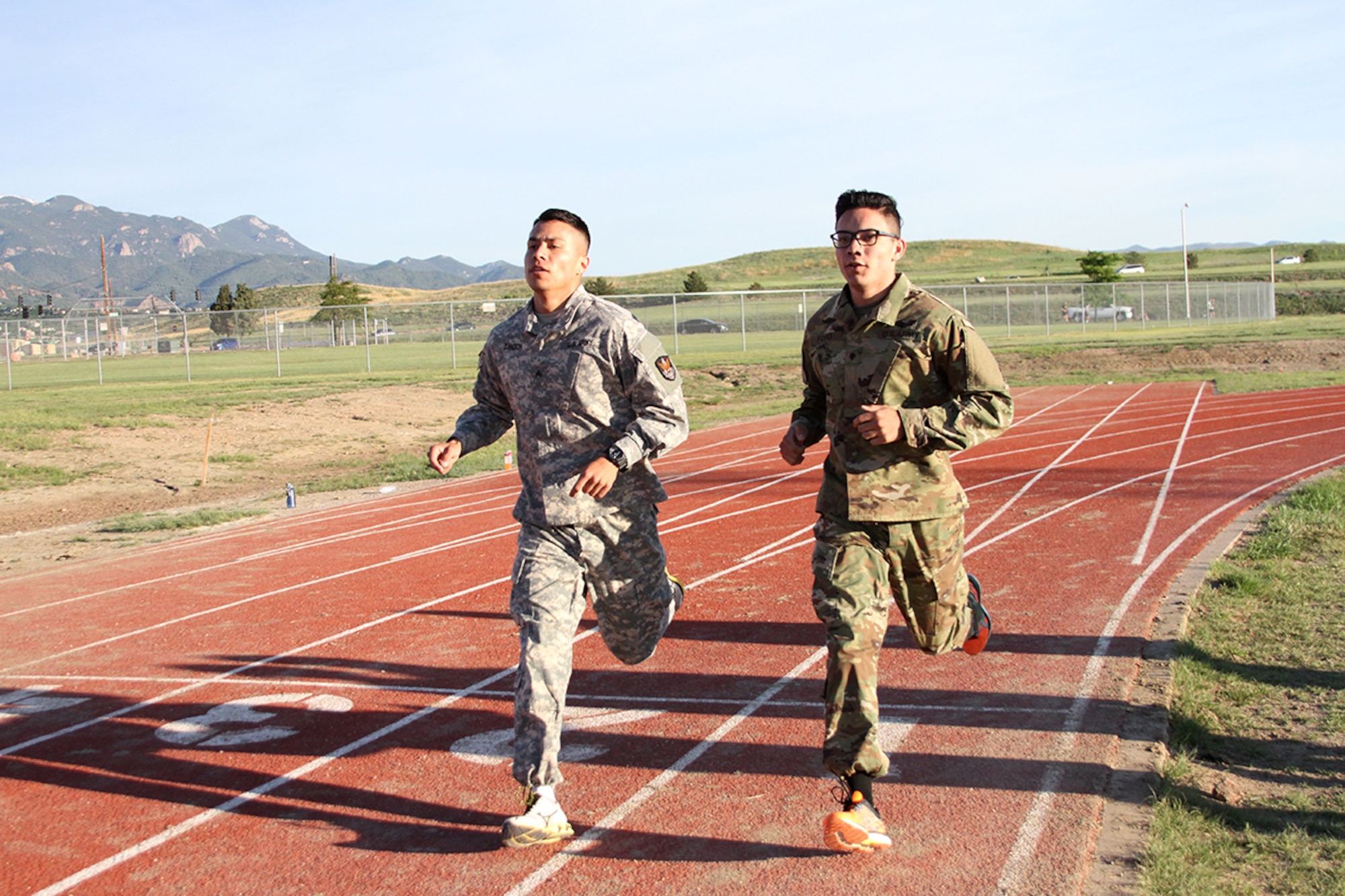 FORT CARSON, Colo. - Sgt. Steven Johnson, Headquarters and Headquarters Company, 53rd Signal Battalion, left, and Spc. William Ford, Company C, 53rd Signal Battalion, pace their 2-mile run of the Army Physical Fitness Test at Fort Carson, Colorado, during the Best Warrior Competition June 6. Johnson was named the U.S. Army Space and Missile Defense Command/Army Forces Strategic Command’s noncommissioned officer Best Warrior and Ford was named the command’s Soldier Best Warrior for 2016. (Photo by Carrie E. David SMDC/ARSTRAT)