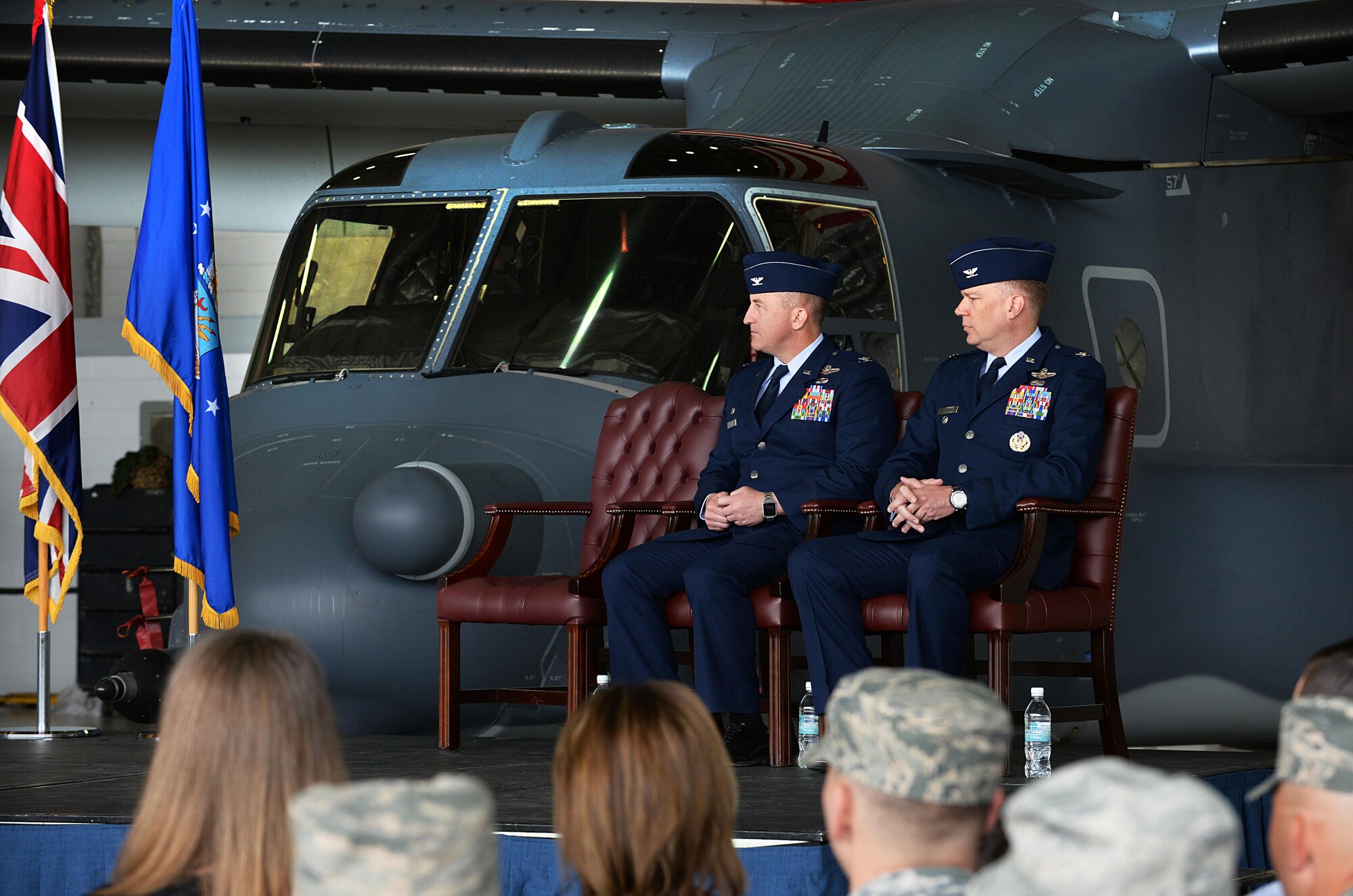 U.S. Air Force Col. Nathan C. Green, left, outgoing 752nd Special Operations Group commander, and Col. Lance E. Schmidt, right, incoming 752nd SOG commander, listen to the presiding officer during a change of command ceremony June 10, 2016, on RAF Mildenhall, England. The ceremony is a time-honored tradition in which one officer relinquishes command and passes it to another. (U.S. Air Force photo by Airman 1st Class Tenley Long/Released)