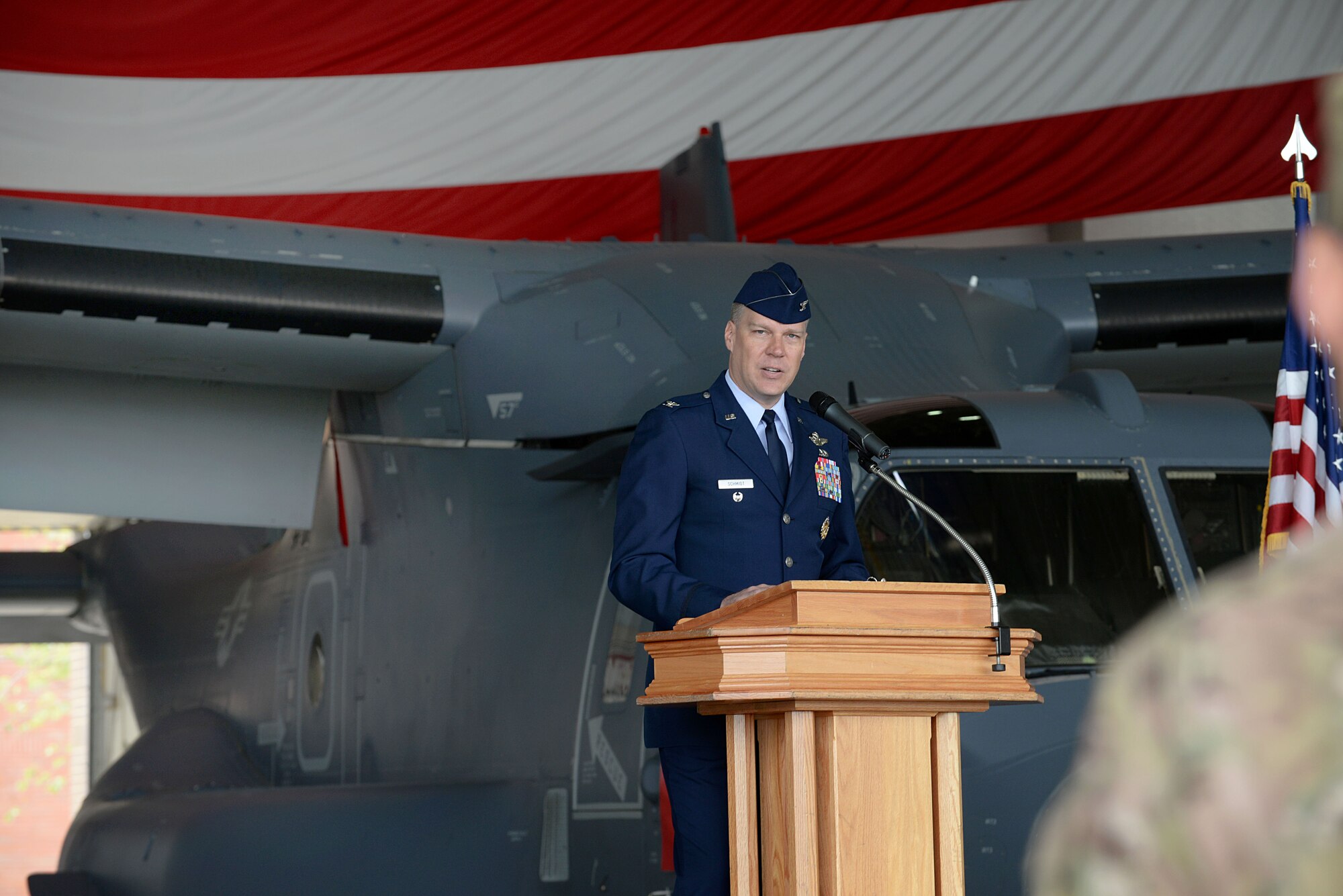 U.S. Air Force Col. Lance E. Schmidt, incoming 752nd Special Operations Group commander, addresses the crowd during his change of command ceremony June 10, 2016, on RAF Mildenhall, England. The 752nd SOG is responsible for planning and executing specialized and contingency operations using advanced aircraft, tactics and air refueling techniques to infiltrate, exfiltrate and resupply special operations forces. (U.S. Air Force photo by Airman 1st Class Tenley Long/Released)