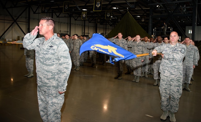 Airmen from the 521st Air Mobility Operations Wing give a final salute to the outgoing commander, Col. Nancy Bozzer, at Ramstein Air Base, Germany, June 14, 2016. Bozzer handed command to Col. Thomas Cooper during the change-of-command ceremony. (U.S. Air Force photo/Staff Sgt. Armando A. Schwier-Morales)