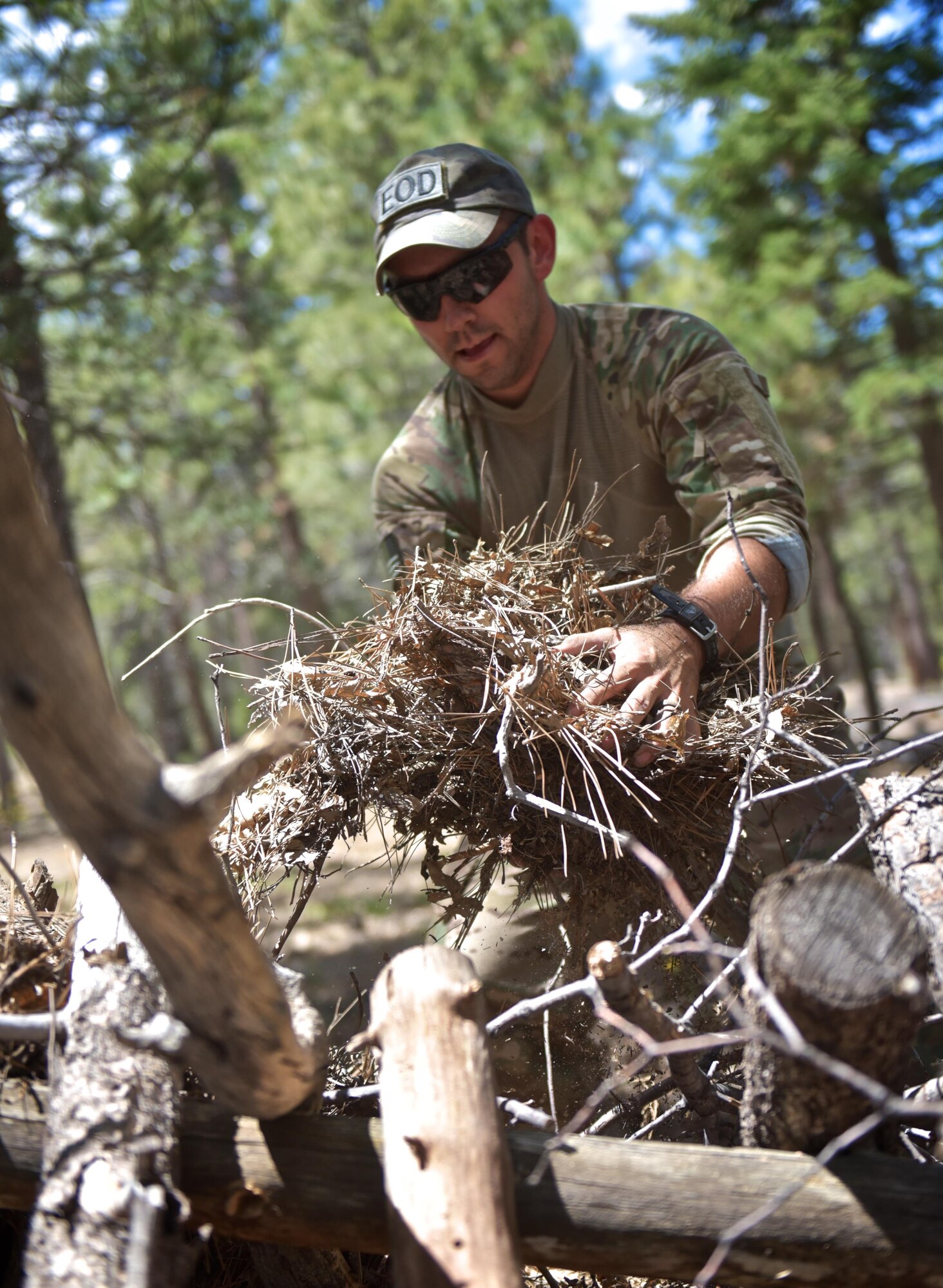 Staff Sgt. Christopher Priddy, member of the the 932nd Airlift Wing explosive ordnance disposal team works on his A-frame shelter during a week long survival course in the San Bernardino mountains, June 1, 2016, Angelus Oaks, California.  The 932nd AW EOD team attended the course to learn basic survival skills that might help if ever stranded during a deployment or training exercise. 
(U.S. Air Force photo by Tech. Sgt. Christopher Parr)