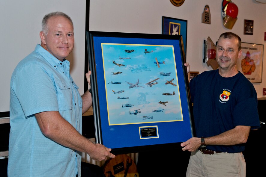 U.S. Air Force Reserve Col. Craig Drescher, commander, 913th Airlift Group, (right) poses for a photo with Col. Joseph Wilson, vice commander, 189th Airlift Wing, Arkansas Air National Guard, during a farewell tribute at Little Rock Air Force Base, Ark., June 11, 2016. In the tradition of the military “hail and farewell,” co-workers and friends gathered to thank Drescher for his service at Little Rock AFB. (U.S. Air Force photo by Master Sgt. Jeff Walston/Released)