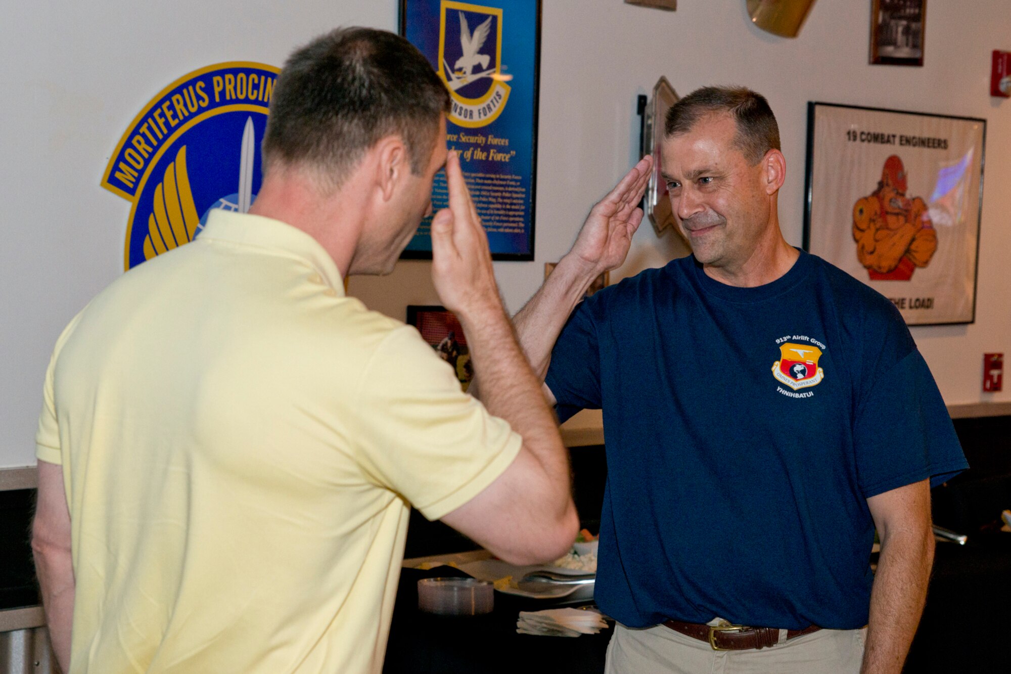 U.S. Air Force Reserve Col. Craig Drescher, (right) commander, 913th Airlift Group, receives a farewell salute from U.S. Air Force Col. James Dryjanski, commander, 314th Airlift Squadron, during a tribute at Little Rock Air Force Base, Ark., June 11, 2016. Team Little Rock commanders have a long history of supporting each other and networking ideas that can benefit everyone. (U.S. Air Force photo by Master Sgt. Jeff Walston/Released)