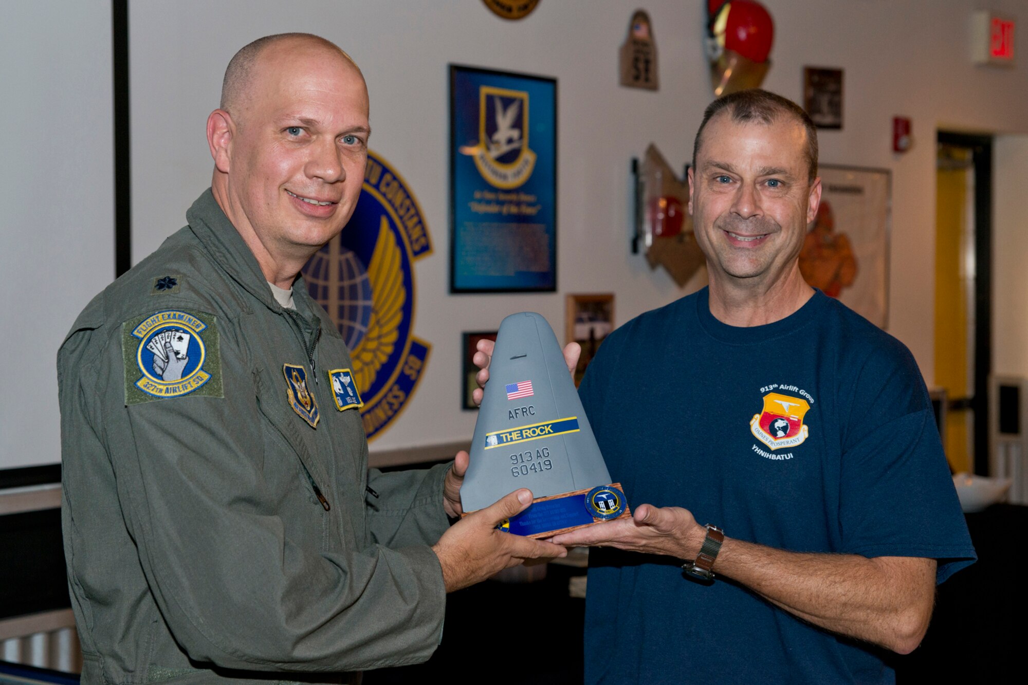 U.S. Air Force Reserve Lt. Col. Neil Hede, commander, 327th Airlift Squadron, and Col. Craig Drescher, commander, 913th Airlift Group, pose for a photo during a farewell tribute at Little Rock Air Force Base, Ark., June 11, 2016. Drescher is leaving the 913th AG to take a position at Air Force Reserve Command Headquarters at Robins Air Force Base, Ga. (U.S. Air Force photo by Master Sgt. Jeff Walston/Released)
