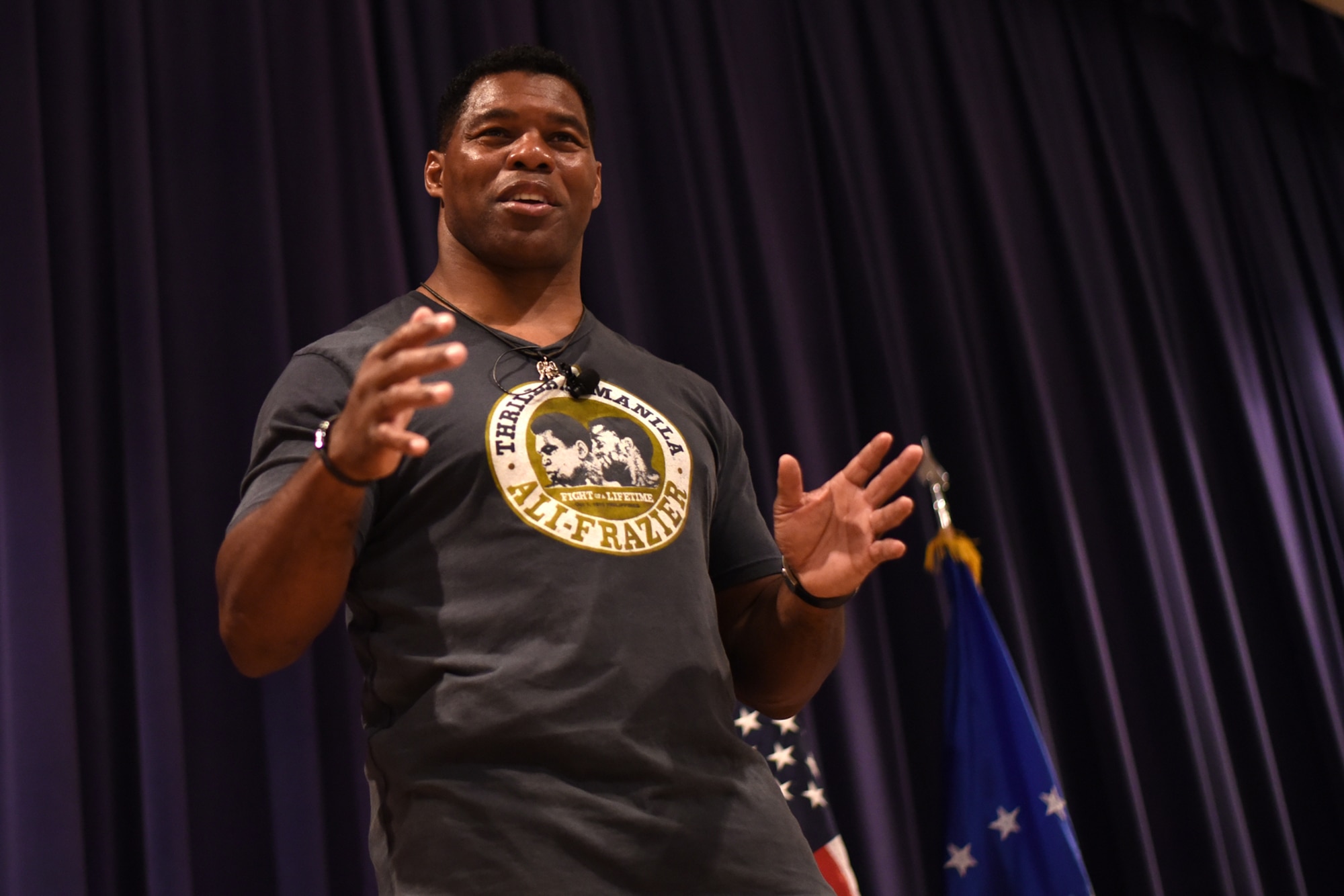 PETERSON AIR FORCE BASE, Colo. – Herschel Walker, retired NFL football player, speaks on resiliency to Team Pete in the base auditorium at Peterson Air Force Base, Colo. on June 8, 2016. Walker shared stories of his battle with Dissociative Identity Disorder in hopes to motivate service members to address their problems and get help to overcome them. (U.S. Air Force photo by Airman 1st Class Dennis Hoffman)