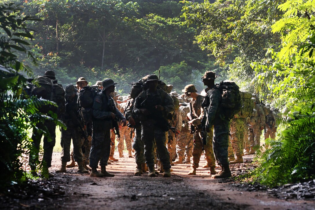 U.S. soldiers line up before participating in operations at the French jungle warfare school in Gabon, June 6, 2016. The soldiers, assigned to the 3rd Infantry Division’s Company B, 3rd Battalion, 7th Infantry Regiment, 2nd Infantry Brigade Combat Team, are attending the school as part of Central Accord 2016, a U.S. Army Africa exercise bringing together partner nations to practice and demonstrate proficiency in peacekeeping operations. Army photo by Sgt. Henrique Luiz de Holleben
