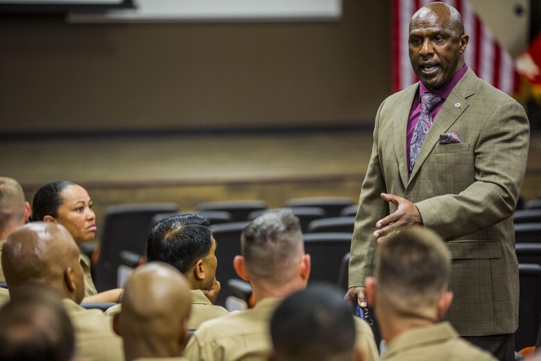 Marine Corps Base Camp Pendleton, Calif. -- Mr. Harrison Tanksley, Career Course Seminar chief instructor, College of Distance Education and Training, congratulates the staff sergeants of the first annual year class of Career Course Seminar on Camp Pendleton  May 26, 2016. To be eligible for promotion, staff sergeants are required to attend Career Course. (U.S. Marine Corps photo by Sgt. Tony Simmons/Released)