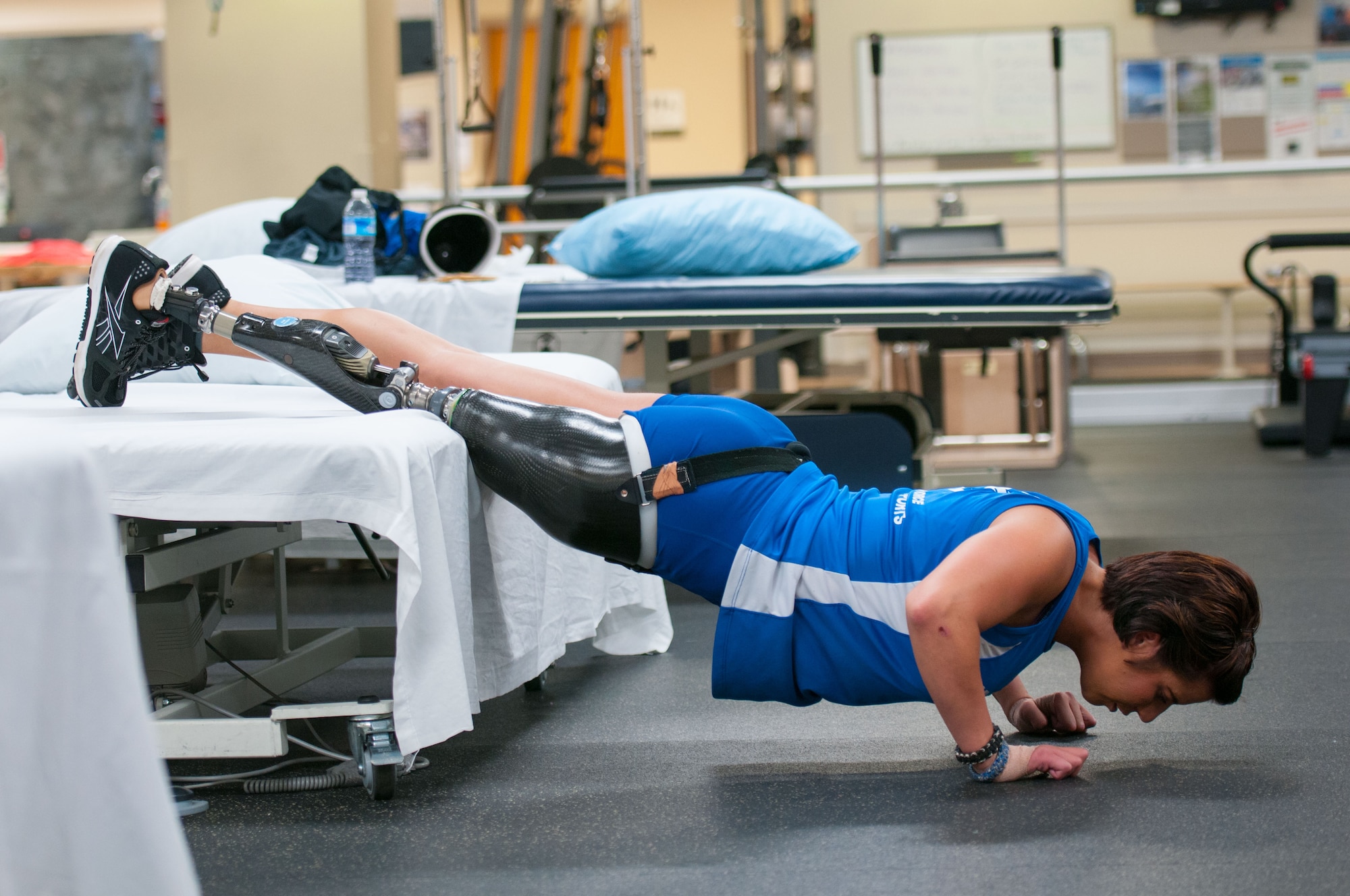 Staff Sgt. Sebastiana Lopez Arellano, a patient at Walter Reed National Military Medical Center, does pushups during her therapy session at the center’s Military Advanced Training Center, which provides amputee patients with state-of-the-art care, in Bethesda, Md., April 16, 2016. Lopez lost her right leg and suffered several other injuries in a motorcycle crash in 2015. She now uses sports and fitness as part of her physical and occupational therapy regimen. (U.S. Air Force photo/Sean Kimmons)